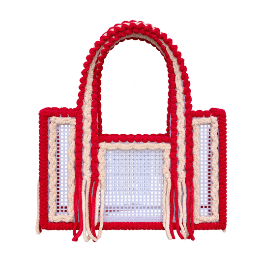 Front view of the Cherry Vanilla handmade crochet mesh tote bag in cherry red and creamy vanilla yarn with fringe