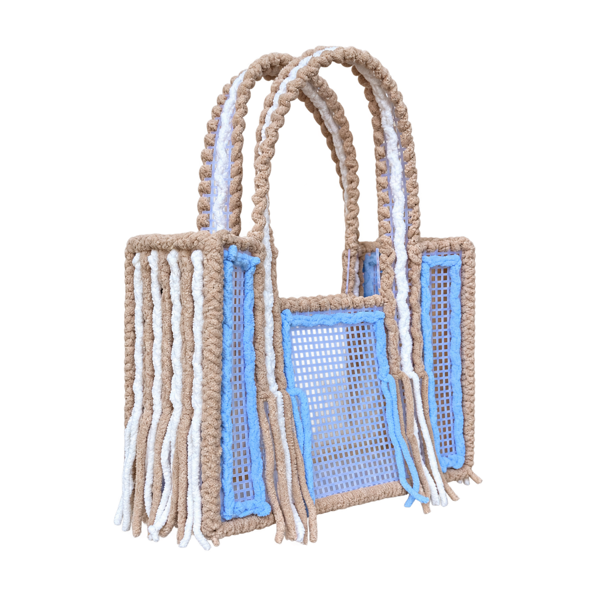 Side view of the Iced Latte crochet mesh tote bag showing twin yarn-wrapped handles and fringe