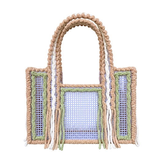 Front view of the Matcha Latte handmade crochet mesh tote bag in latte beige, white and matcha green yarn with fringe