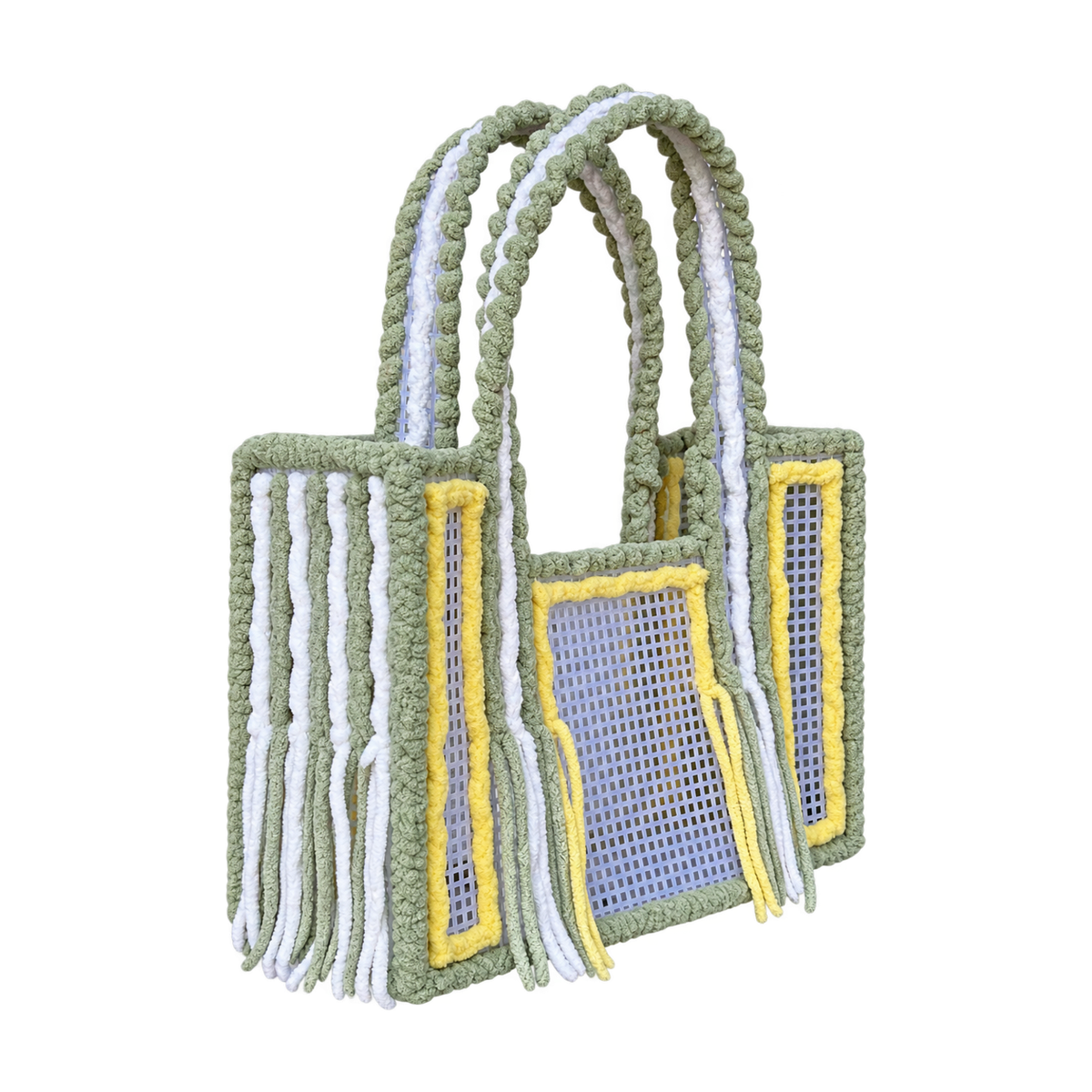 Side view of the Matcha Lemonade crochet mesh tote bag showing twin green and white yarn-wrapped handles and fringe