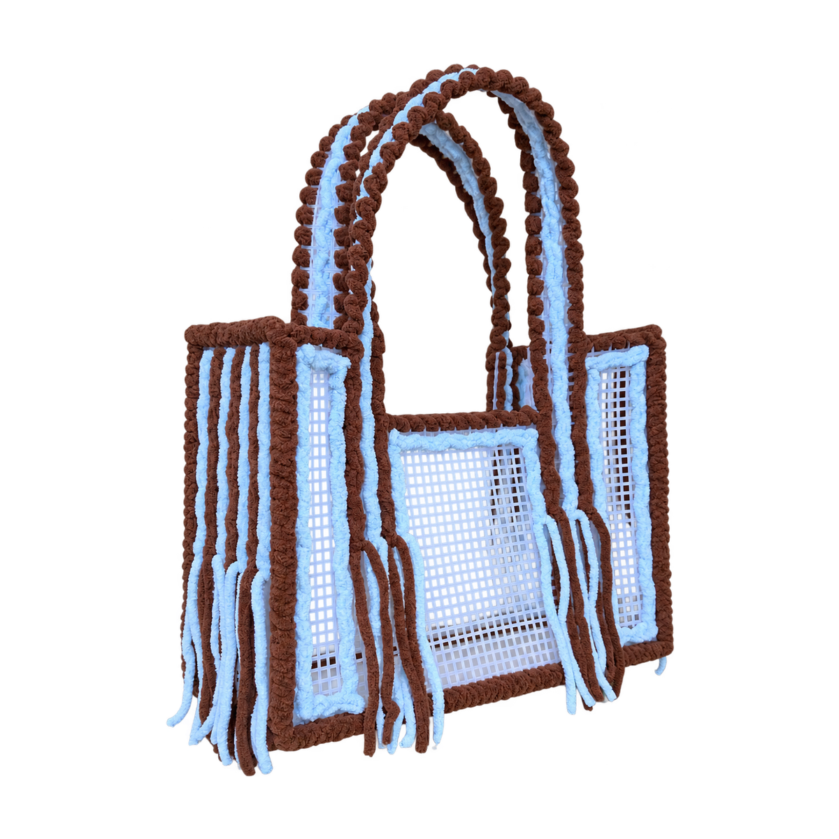 Side view of the Mocha Sky crochet mesh tote bag showing twin brown yarn-wrapped handles and blue fringe
